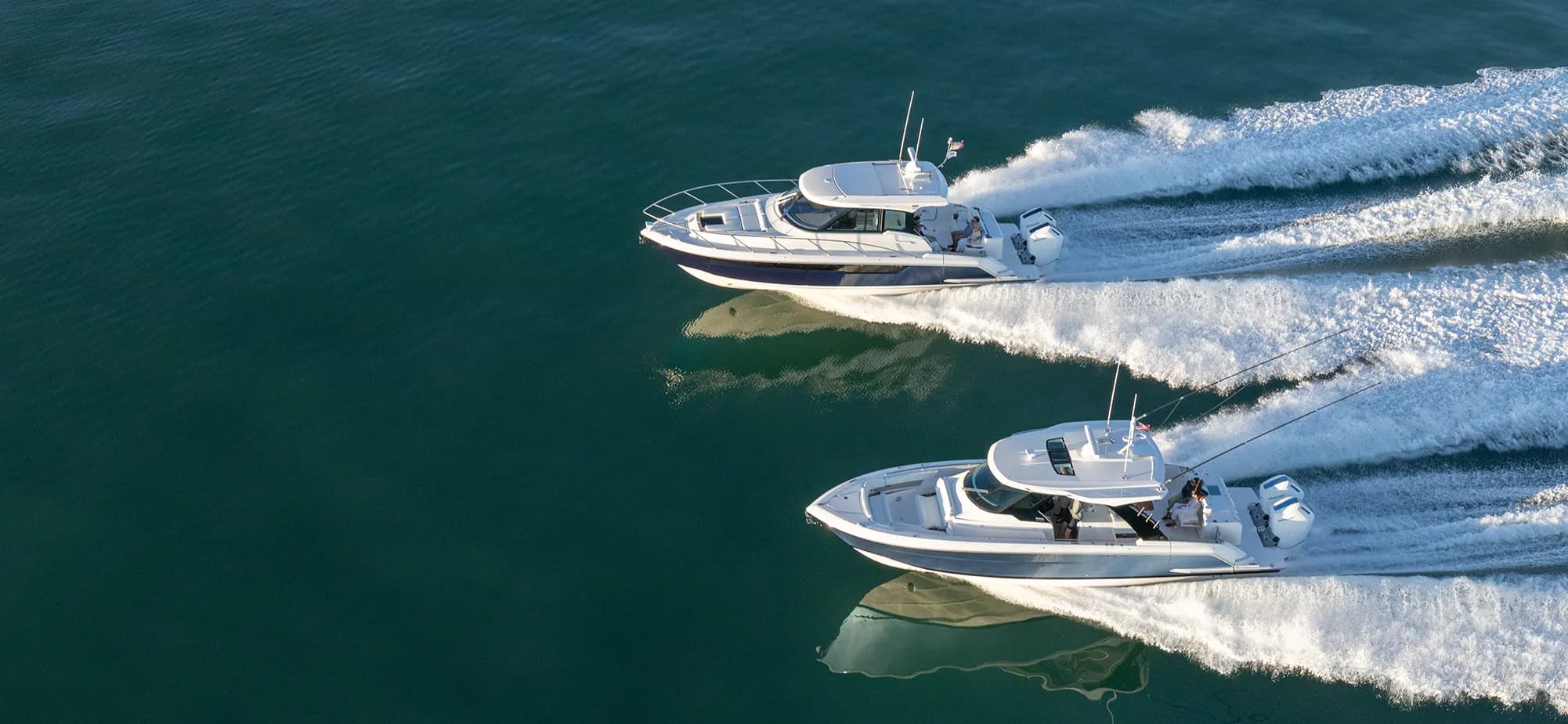 Family fishing off the terrace of the 39 LS, buoyed up the 39 LE with guests in aft lounge.